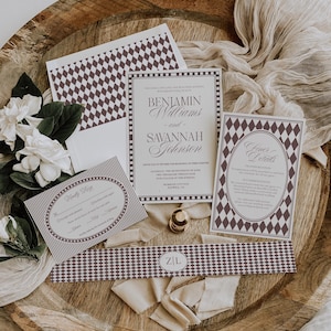May include: Wedding invitation suite featuring a main invitation, RSVP card, and details card. The design includes a diamond pattern and the names Benjamin Williams and Savannah Johnson. The suite is arranged on a wooden tray with floral accents.