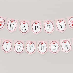 May include: Pink and white banner with red cherries and the words "Happy Birthday" in black.
