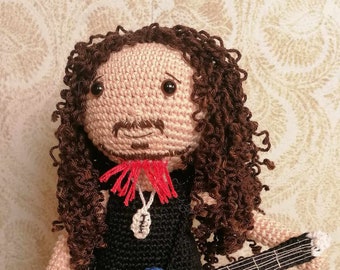 Amigurumi doll guitar player