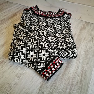 Kihnu troi sweater. These trois are the most popular and vivid items of traditional Estonian knitwear.The pattern includes the eight-point star, which is a protective
motif.