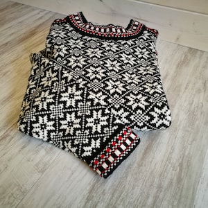 Kihnu troi sweater. These trois are the most popular and vivid items of traditional Estonian knitwear.The pattern includes the eight-point star, which is a protective
motif.