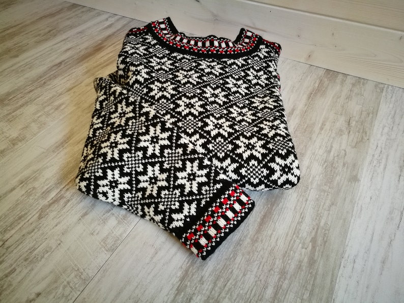 Kihnu troi sweater. These trois are the most popular and vivid items of traditional Estonian knitwear.The pattern includes the eight-point star, which is a protective
motif.