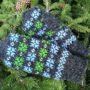 Fair isle knitted mittens in ethnic Estonian flower pattern style black and blue-green combination