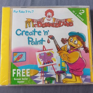 May include: A sealed McDonaldland "Create 'n' Paint" CD-ROM for children aged 3 to 7. The cover shows Ronald McDonald and a cartoon character painting a purple elephant. Includes a free screen saver.