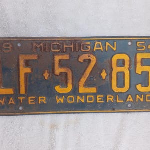 Vintage 1954 Michigan License Plate Blue and Yellow