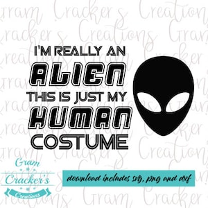May include: Black and white graphic design with the text "I'm really an alien this is just my human costume". A black alien head is on the right side of the design.