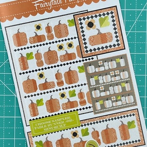 May include: A quilting pattern featuring a variety of pumpkin designs. The pattern is titled "Fairytale Pumpkins" and includes instructions for making a sampler, table runner, or mini quilt.