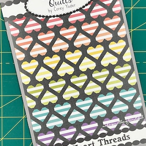 May include: A quilt pattern booklet with a colorful heart design. The cover features the title "Coriander Quilts" by Corey Yoder and the text "#189 Heart Threads".