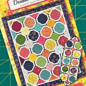 May include: A quilting pattern booklet titled "Double Takes 4" by Heather Peterson for Anka's Treasures. The pattern is 5" and 10" square friendly. The cover features a colorful quilt design with a variety of geometric shapes.