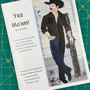 May include: A white card with a colorful image of a cowboy with a mustache and a black hat. The text "Yes Ma'am!" is at the top of the card. The text "By Laura Heine" is below the title. The card also includes information about the pattern, the designer, and the copyright.