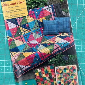 May include: A quilting pattern booklet titled "Slice and Dice" with a 10-inch square friendly design. The cover features a colourful quilt with a blue, red, yellow, and green colour scheme. The quilt is displayed on a wicker chair with cushions. The booklet also shows two smaller quilt designs.