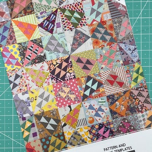 May include: A quilt pattern booklet titled "A Wild Ride" with a colorful patchwork quilt design on the cover. The booklet includes acrylic templates and is by Jen Kingwell.