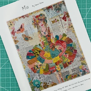 May include: A colorful fabric art print titled "Mia" by Laura Heine. The artwork features a woman with a floral headdress and a patchwork dress. Two butterflies are also visible. The print is on a white background.