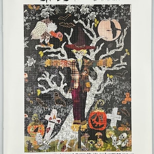 May include: A colorful, illustrated pattern of a scarecrow standing in a tree with a pumpkin, a cross, and other Halloween-themed imagery. The text "SCARECROW BY LAURA HEINE" is at the top of the image. The text "FIBERWORKS INC 3213 HENESTA DRIVE BILLINGS MT 59102 406-656-6663 FIBERWORKS-HEINE.COM OLAURA HEINE 2021 DO NOT PHOTOCOPY, REPRODUCE, RESIZE OR SHARE." is at the bottom of the image.
