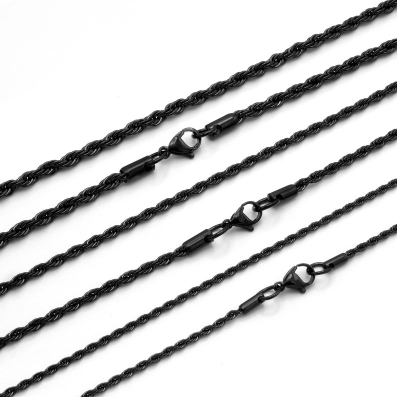 May include: Five black rope chains of varying lengths with lobster claw clasps.