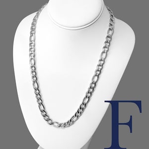 May include: A silver Figaro chain necklace with a 9mm width, made of stainless steel 316L. The chain is displayed on a white mannequin.
