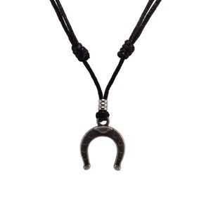 May include: A black cord necklace with a silver horseshoe pendant.
