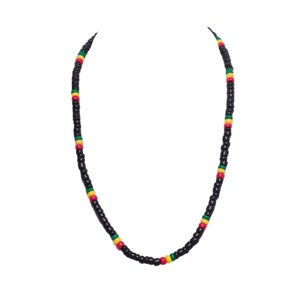 May include: A black beaded necklace with red, yellow, and green accents. The necklace is made of small, round beads.