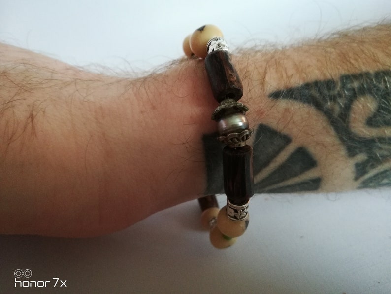 rigid bracelet man with Tahitian pearl acai seeds and malachite pearls
