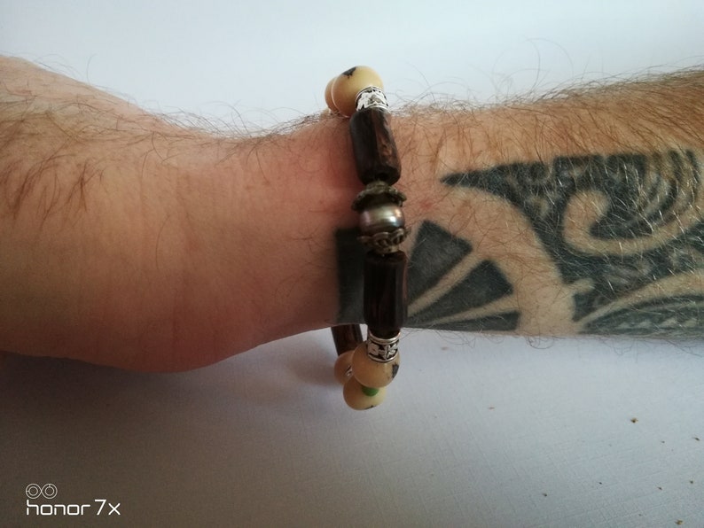 rigid bracelet man with Tahitian pearl acai seeds and malachite pearls