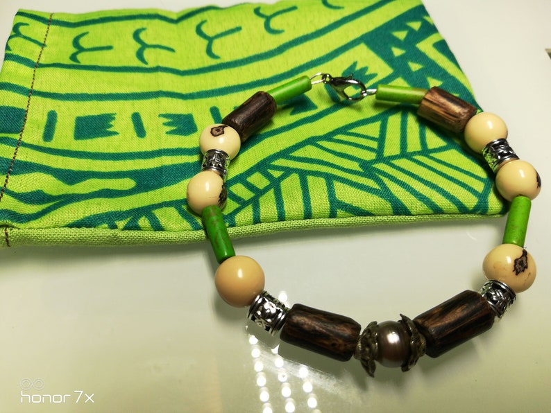 rigid bracelet man with Tahitian pearl acai seeds and malachite pearls