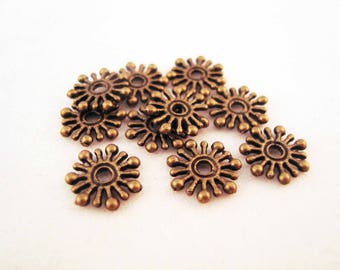 INT42 - 50 Bronze spacer beads in the shape of a Snowflake / Flower 9MM