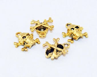 TM42 - 2 Mignons Pendentifs Breloques Tête de Mort de couleur Doré yeux noirs