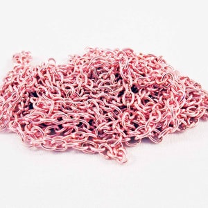 May include: A pile of rose gold chain links, perfect for jewelry making or crafting projects.