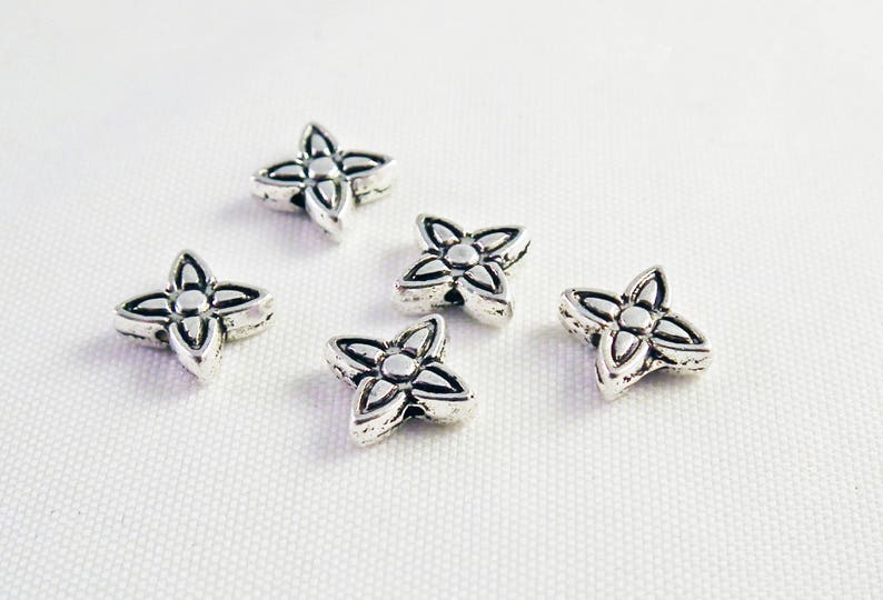 INT11 Shaped flowers stars obsolete money patterned spacer beads
