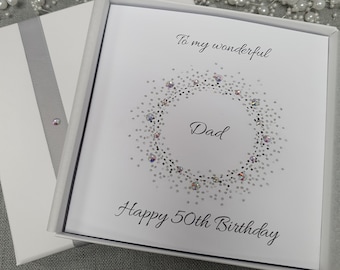 May include: White card with a silver glitter wreath and the words "To my wonderful Dad Happy 50th Birthday".