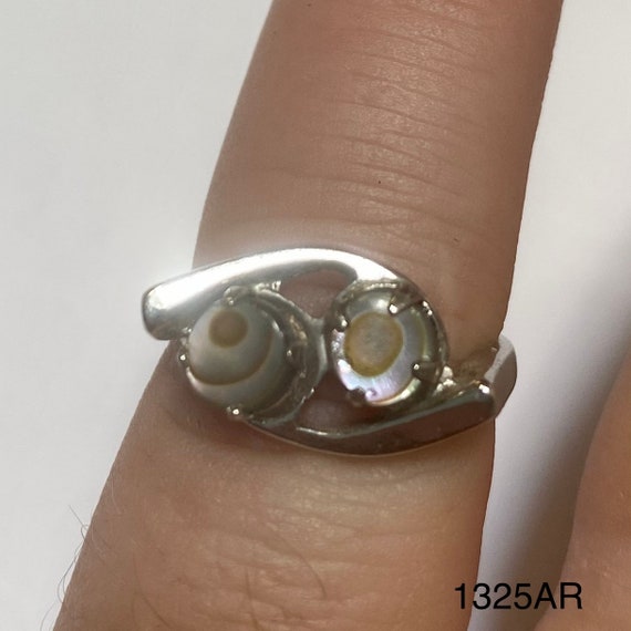 Silver colored ring with 2 small abalone colored … - image 1