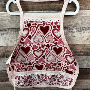 Apron,  Toddler Valentines Chef style Hearts, Hearts, Hearts on a White background color…..Size….Toddler 2/3