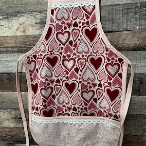 Apron,  Child Valentines Chef style Hearts, Hearts, Hearts on a White background color…..Size….Med.Child 4/5