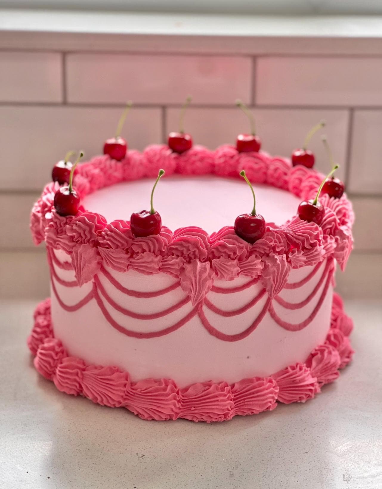 10 inch cake in pink with cherries