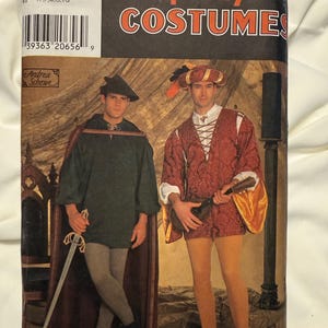 May include: Simplicity Costumes sewing pattern 7761 for sizes XS, S, M, L, XL. The package features two historical-style outfits: a dark green tunic with a cape and sword, and a red patterned tunic with gold sleeves, a lace-up front, and a hat.