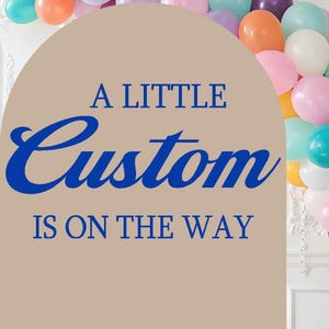 May include: A display of pastel-colored balloons in a variety of colors, including pink, blue, yellow, and orange. The balloons are arranged in an arch shape. The text "A LITTLE Custom IS ON THE WAY" is displayed in blue.