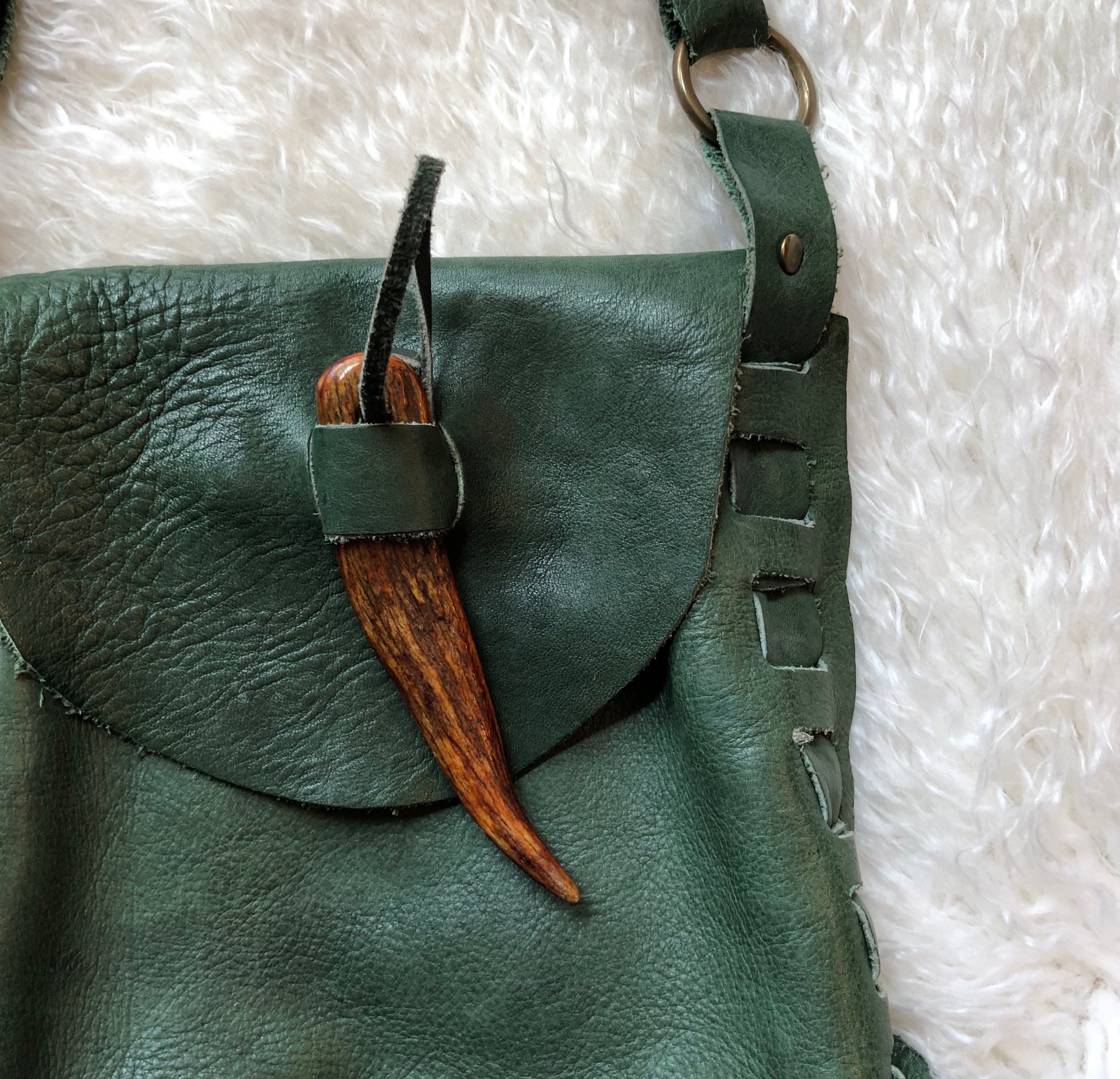 1970s vintage soft green leather purse with wooden tooth shape closure