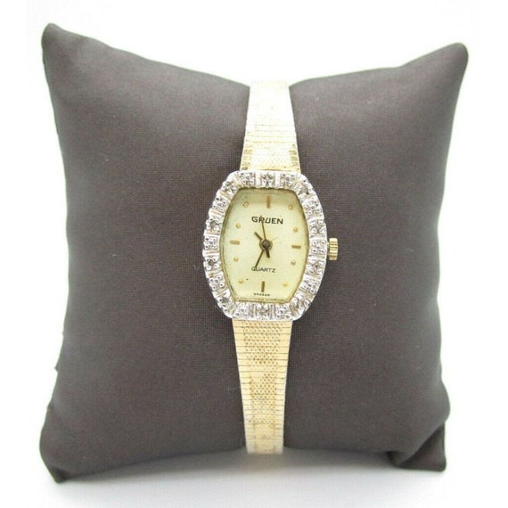 Gruen diamond quartz gold watch top