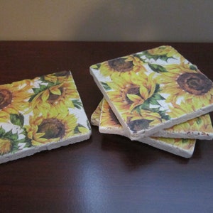 Set of 4 tumbled stone coasters bearing images of bright and cheery sunflowers!  Free shipping in U.S.!