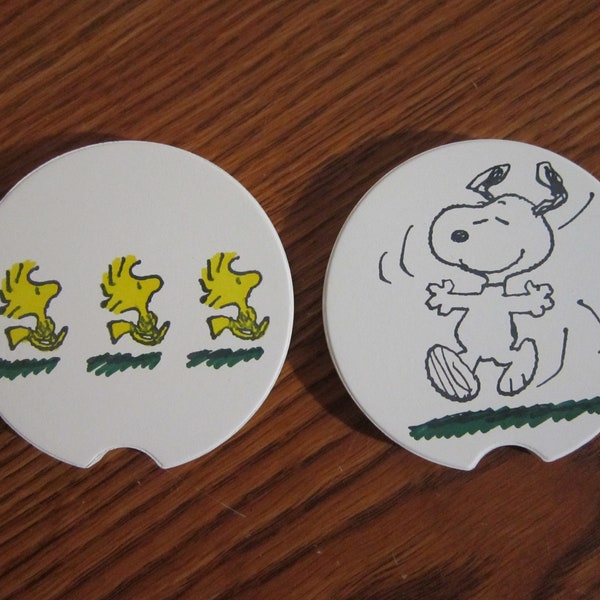 Set of 2 Snoopy & Woodstock car coasters for your cup holders. Featuring the fun loving Peanuts dog and buddy bird.