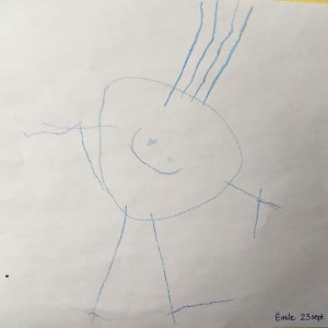 May include: A blue crayon drawing of a person with a large head, arms, and legs. The person has a smiling face and hair on top of their head. The drawing is signed "Emile 23 sept."