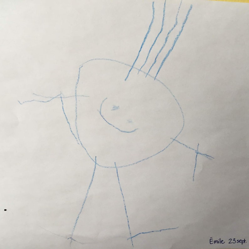 May include: A blue crayon drawing of a person with a large head, arms, and legs. The person has a smiling face and hair on top of their head. The drawing is signed "Emile 23 sept."