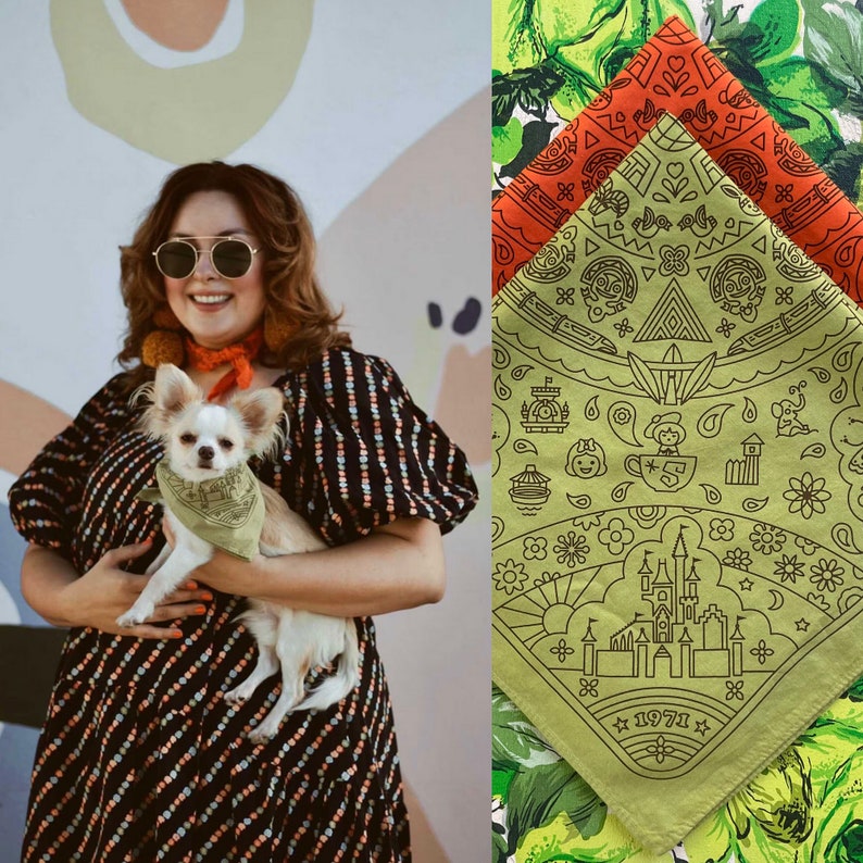 woman and dog wearing both colors of the golden anniversary fandana bandana with WDW images from the 1970s like bob around boats the castle mad tea party tom sawyer island fort jungle cruise elephant and more