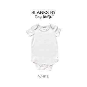 May include: White baby onesie with short sleeves and a snap closure. The onesie is blank and ready to be customized.