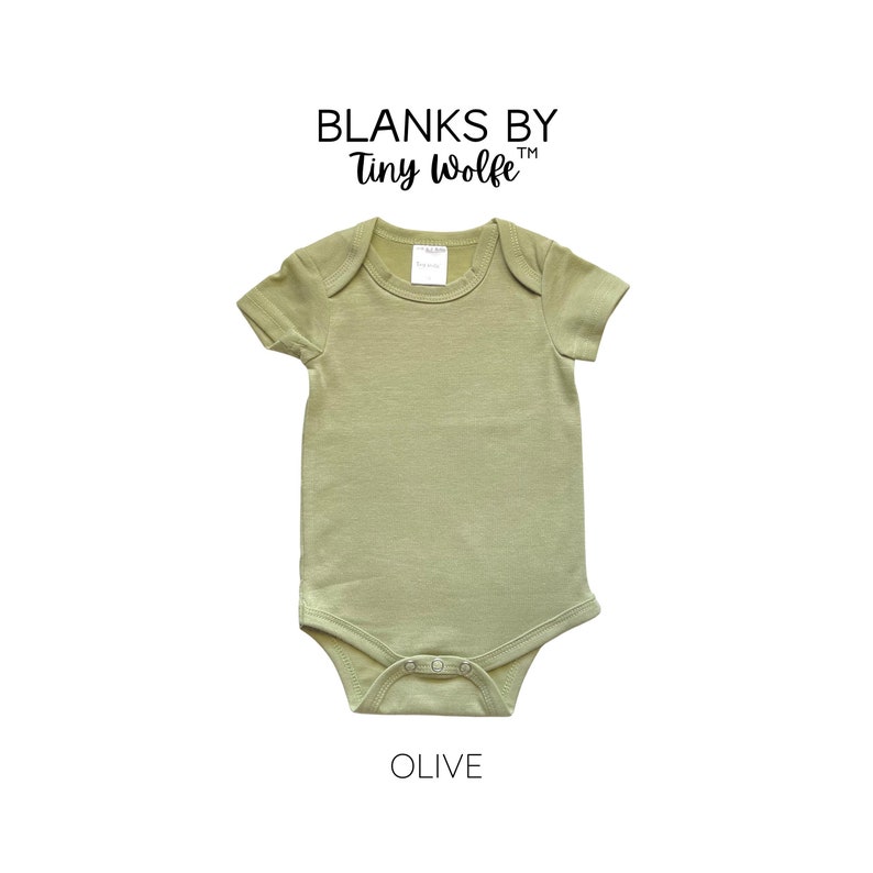 May include: A plain olive green baby onesie with short sleeves and a snap closure. The onesie is made by Blanks by Tiny Wolfe.