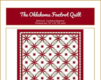 May include: A quilt pattern called "The Oklahoma Foxtrot Quilt" with a red, white, and gray color scheme. The quilt is made up of a repeating pattern of stars and squares. The finished size of the quilt is 70 inches by 92 inches.