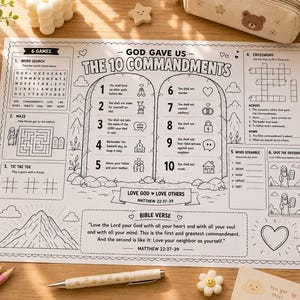 May include: A black and white activity placemat featuring "The 10 Commandments" and games like word search and crossword. Includes coloured pencils, a notepad, and a pen. The placemat has a Bible verse and is designed for children.