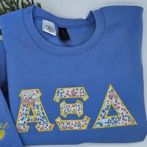 Custom Greek letter sweatshirts. Varsity fabric letter sweatshirts. Superhero Greek letters. Applique letter sweatshirt. Any college.
