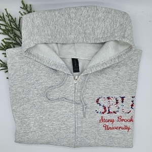 College Custom Floral Embroidered zip up hooded sweatshirt.