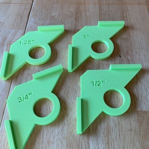 Set of 4 chamfer guides. Perfect for adding consistent angles for cutting boards or any other craft. Sizes are 1.25”, 1”, 3/4”, and 1/2”